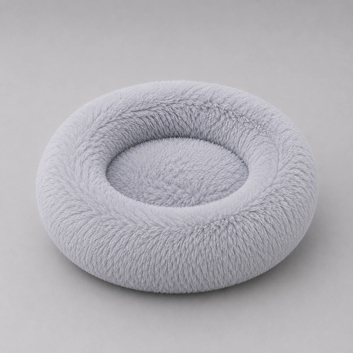 Light Grey Pawro Calming Donut Bed with fluffy raised rim, studio shot