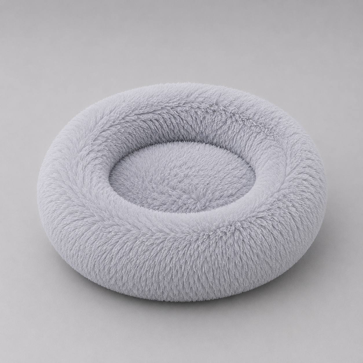 Light Grey Pawro Calming Donut Bed with fluffy raised rim, studio shot